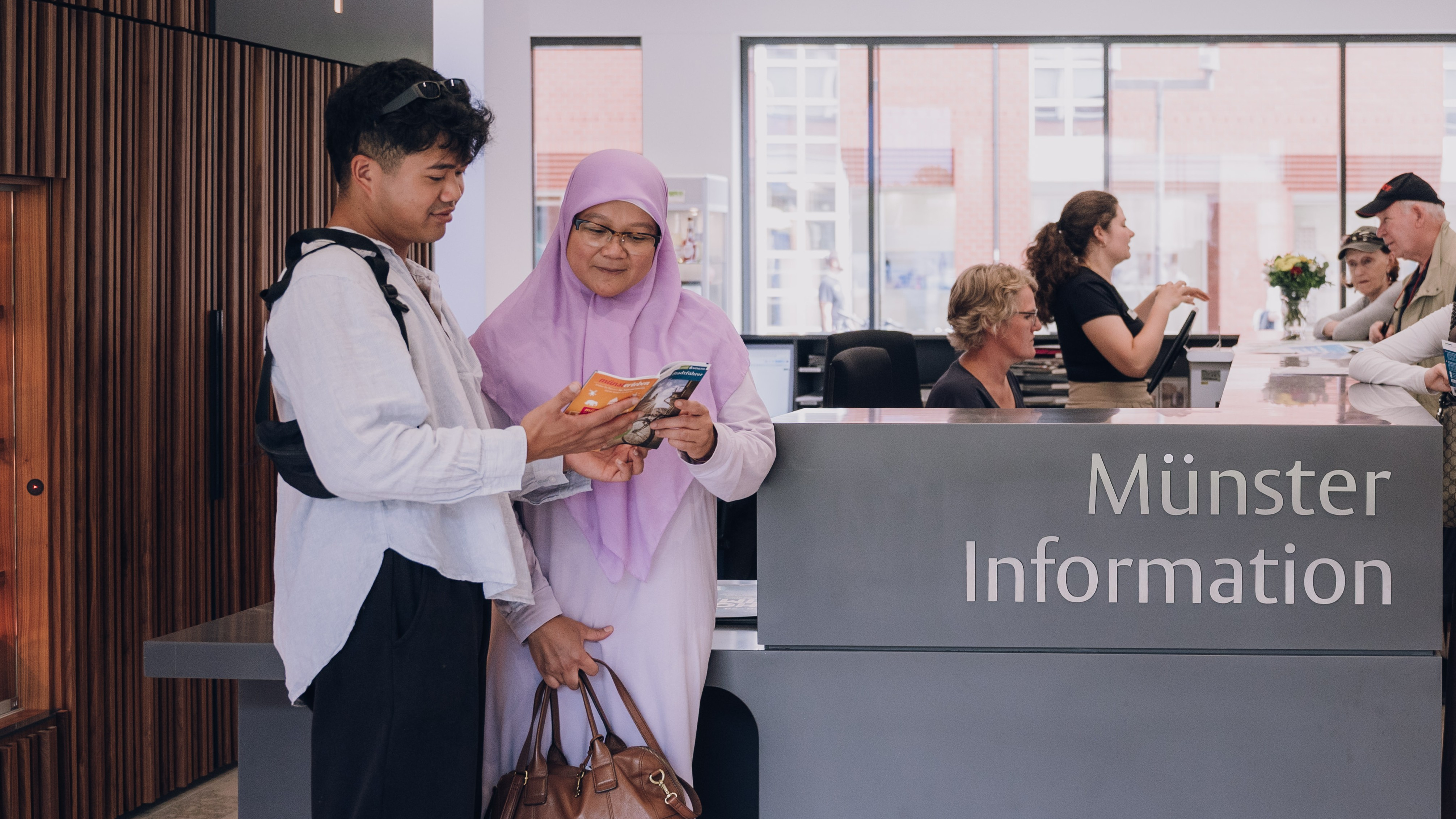 Gäste in der Münster Information