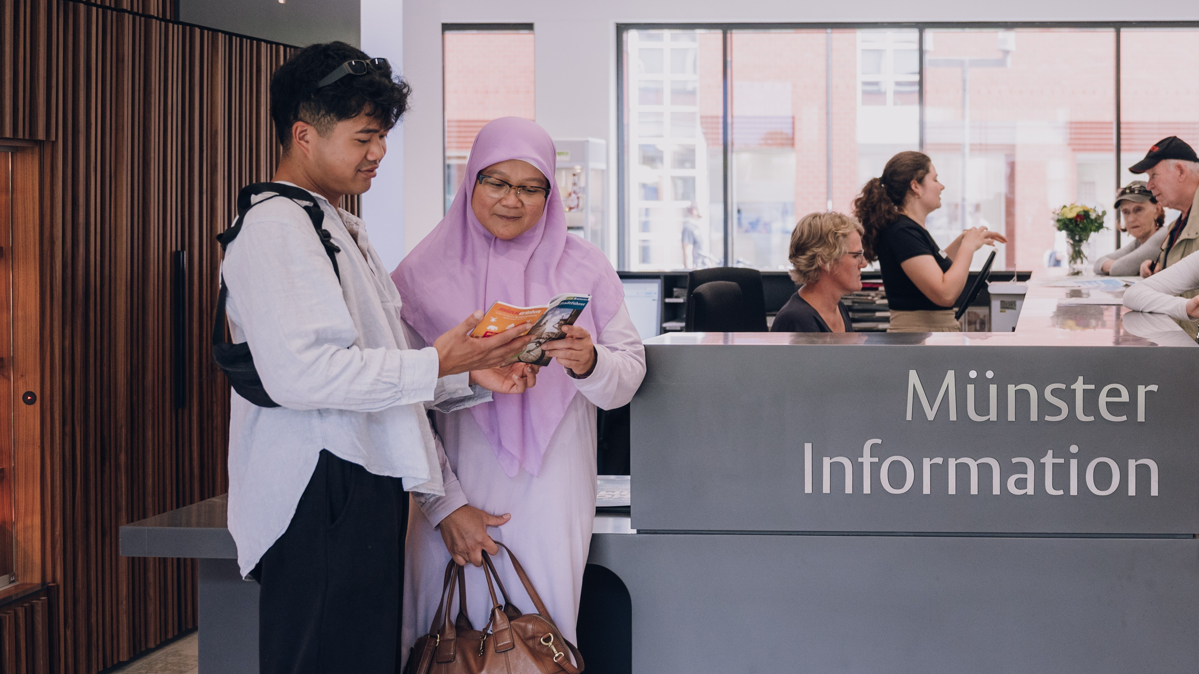 Gäste in der Münster Information