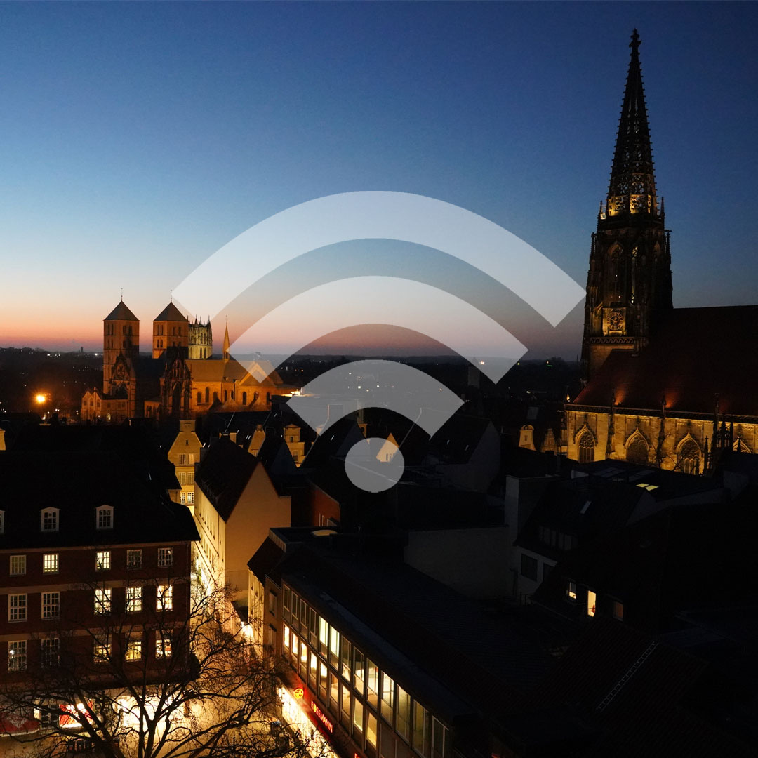 WLAN-Symbol; im Hintergrund Münsters Altstadt