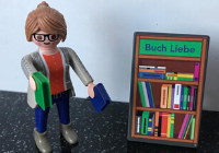 Buchliebe Playmobil-Figur mit Büchern