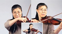 Eine JeKits-Geigenlehrerin führt ihr Instrument vor.